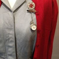 Mattie - Close-up of Mattie's uniform with Ballarat District Nursing Society badge and watch