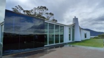 Side view of MONA at ground level - the white chimney looks like a mini lighthouse